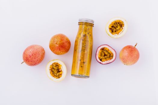 Fresh passion fruit and juice in the bottle for healthy and refresh.