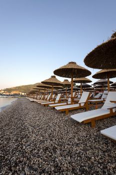   the wooden umbrellas located on a beach. Montenegro