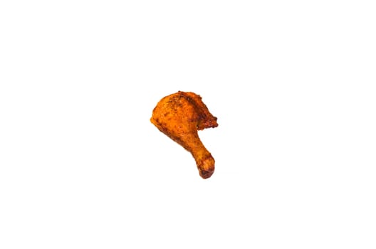 Close up of a fried chicken leg against white background.