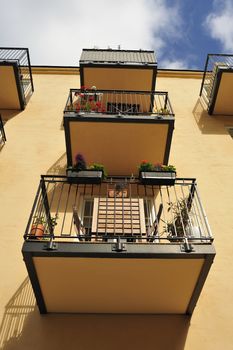 Balconies with blue sky.