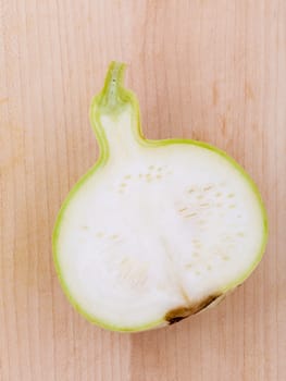 Halved bottle gourd,calabash gourd ,flowered gourd on wooden