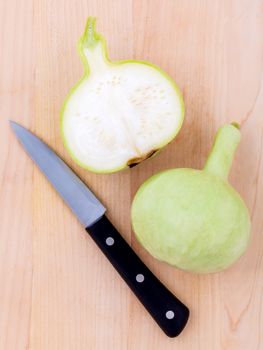 Halved bottle gourd,calabash gourd ,flowered gourd on wooden