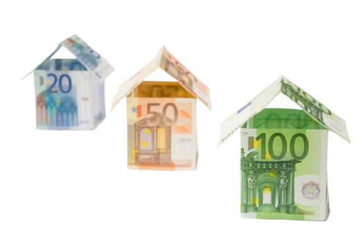 Three houses made of different euro bills isolated on white background