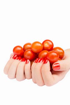 Two hands holding cherry tomatoes isolated on white background