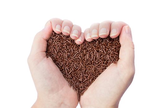 Two hands holding chocolate prinkles as heart symbol  isolated on white background