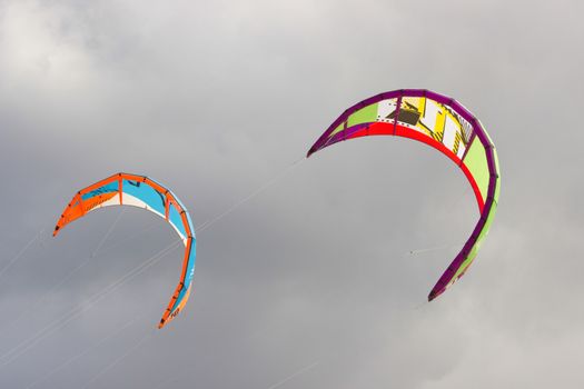 Close up of two colorful kites in the sky