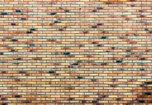 Brick wall as part of house with several different colors