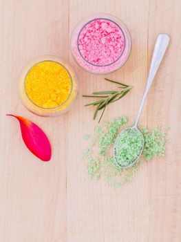 The spa ingredient sea salt and herb on wooden table .