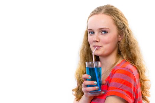 Blonde european teenage girl drinking blue soft drink with straw isolated on white background