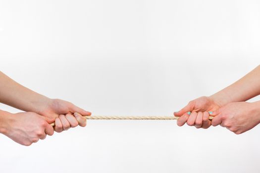 Two opposite persons pulling rope. Four arms isolated on white background