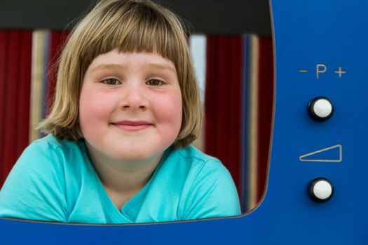 Young european  girl playing in TV