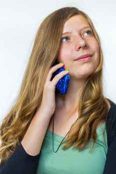 Blonde caucasian teenage girl phoning with mobile telephone