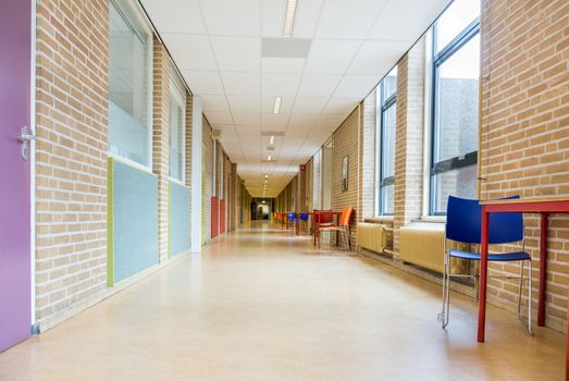 Long corridor with furniture in high school building