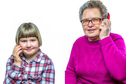 Caucasian grandmother and grandchild phoning with mobile telephone isolated on white background