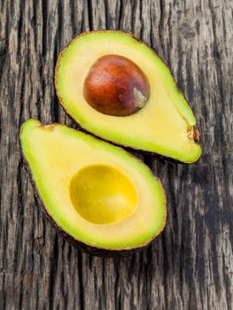 Halved avocado with core isolated on white - in macro shot.