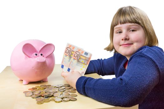 Young girl showing euro money notes and coins for piggy bank isolated on white background