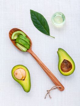 Avocado oil on the white table background clean and healthy concept.