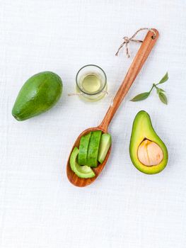 Avocado oil on the white table background clean and healthy concept.