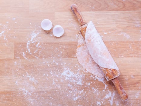 Preparation homemade pasta on wooden table.