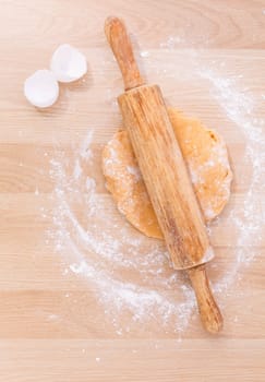 Preparation homemade pasta on wooden table.