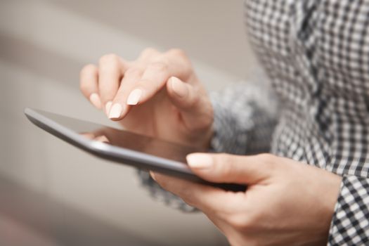 Womanworking with digital tablet. Close-up horizontal photo