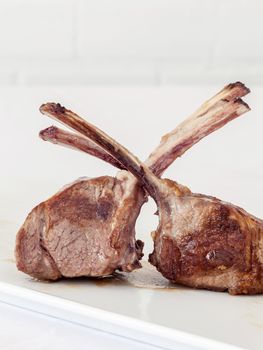 Roasted Lamb Chops on white background.