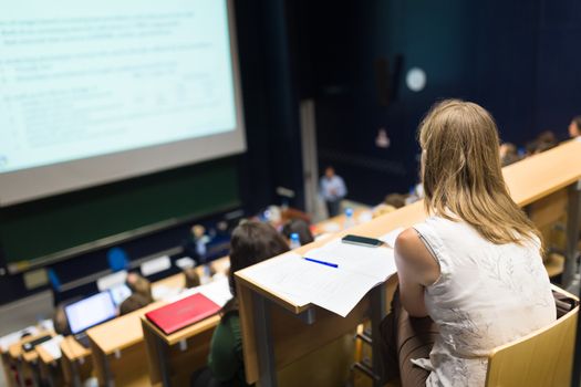 Conference and Presentation. Audience at the conference hall. Business and Entrepreneurship. Faculty lecture and workshop. Audience in the lecture hall. Academic education. Student making notes.