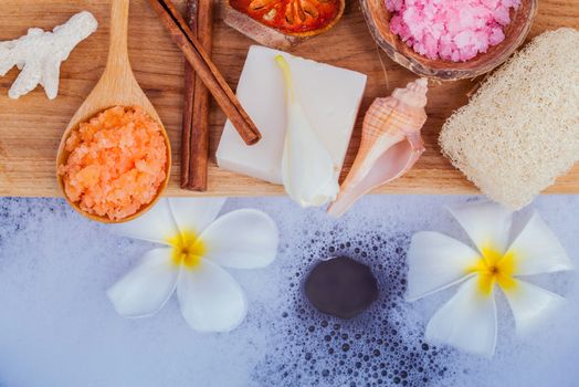 Spa and wellness treatment setup on wooden panel.