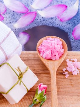 Spa and wellness treatment setup on wooden panel.