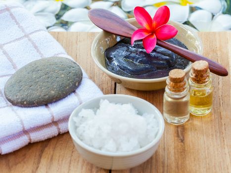 Spa and wellness treatment setup on wooden panel.