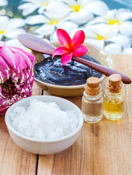 Spa and wellness treatment setup on wooden panel.