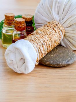 Natural Spa Ingredients . The herbal compress ball and massage oil for spa treatment.