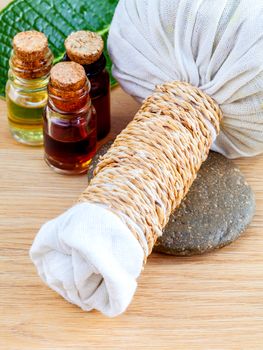 Natural Spa Ingredients . The herbal compress ball and massage oil for spa treatment.