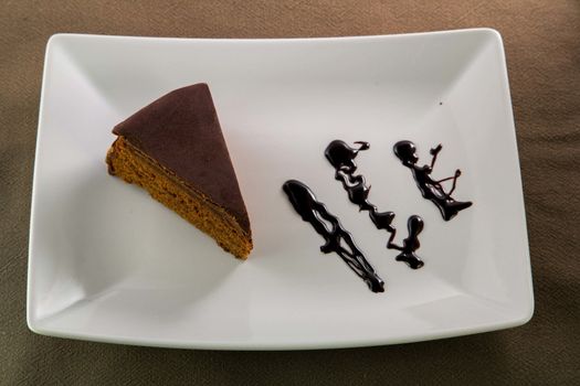 The famous Sacher Cake from Vienna on a white plate