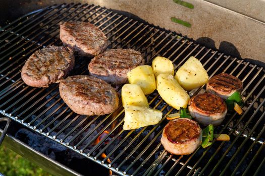 Grilled meat on a summer barbecue in the garden