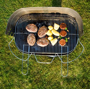 Grilled meat on a summer barbecue in the garden