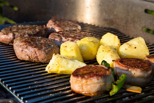Grilled meat on a summer barbecue in the garden