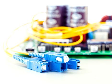 Closeup of fiber optic connector with Circuits board