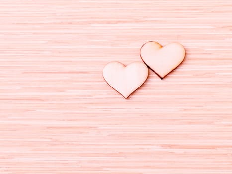 The wooden hearts on wooden background. - Concept for love and wedding .