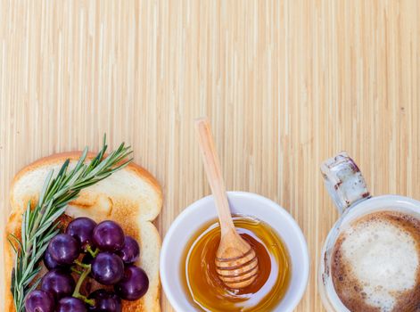 Healthy breakfast with  toasts and herb on wooden table with copy space.