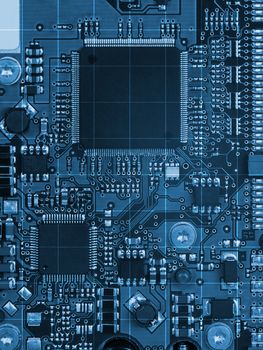 Abstract blue motherboard background with electronic chip, close-up view