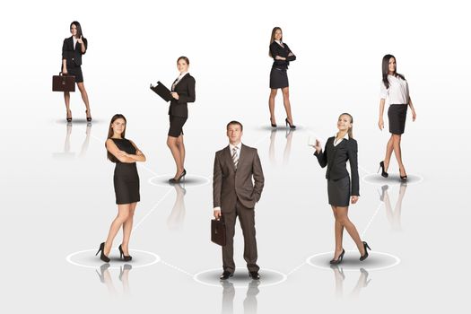 Young attractive business people with man in center looking at camera on isolated white background