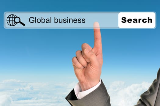 Businessmans hand on blue sky background with words global business in browser 