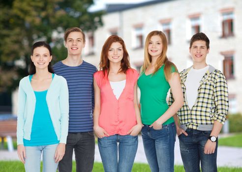 education and people concept - group of smiling students standing