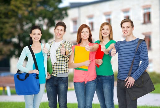 education and people concept - group of smiling students standing