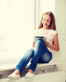 education, school, technology and internet concept - little student girl with tablet pc at school