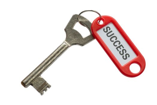 Old key with red label with text success against a white background
