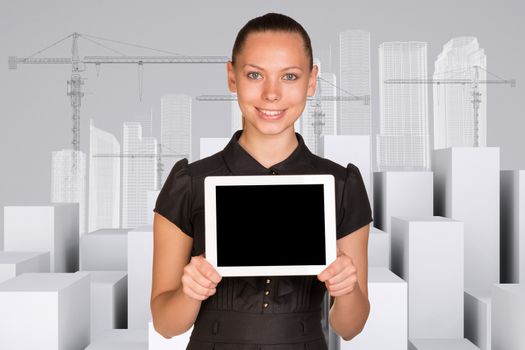 Smiling young woman standing in center holding tablet and looking at camera on abstract background