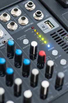 Detail of a Professional Mixing Console Turned On. Music Device.