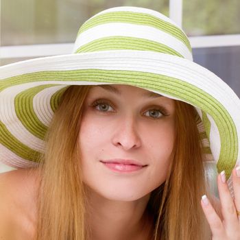 Portrait of pretty cheerful woman wearing straw hat in sunny . square 